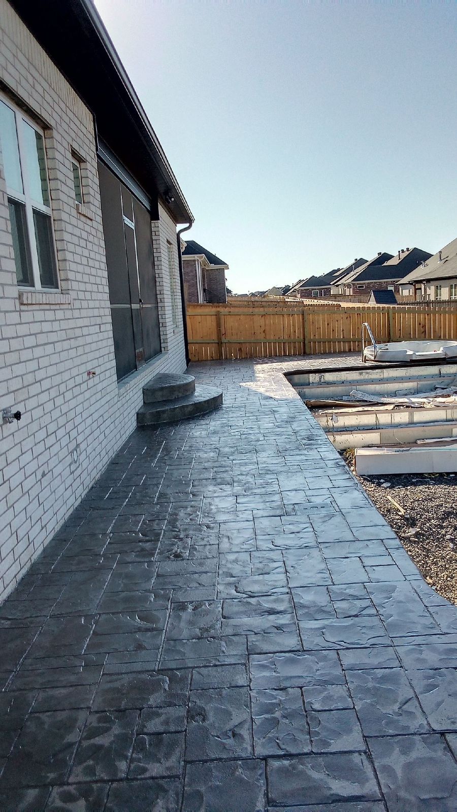 Stamped concrete walkway along a house in Arkansas