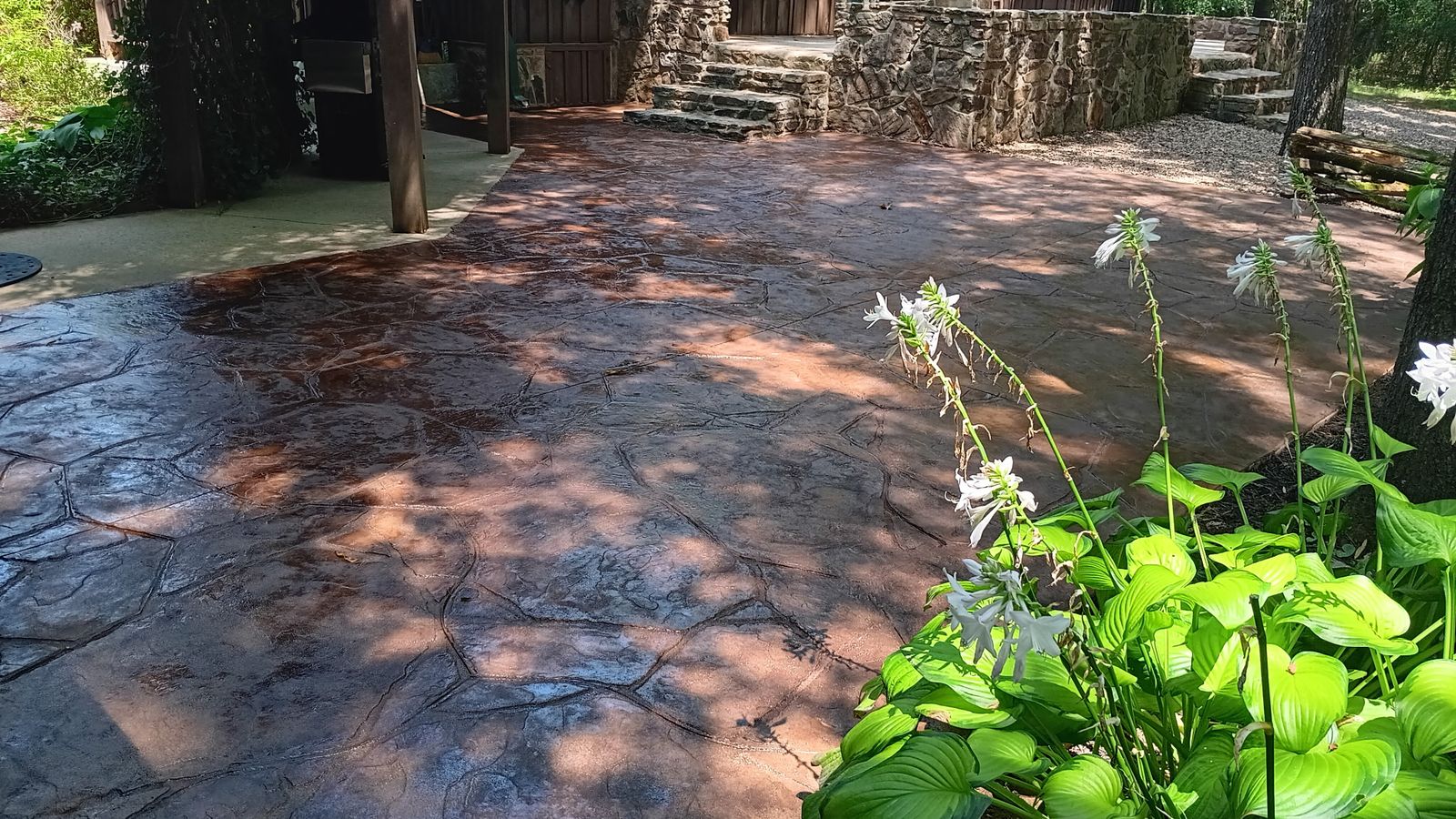 Stamped and stained flagstone concrete patio by Rose Stone and Sons Concrete in Cabot, AR